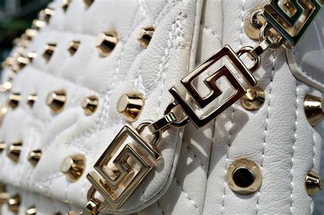 round versace studded vanitas medea white tassel bag|Versace .